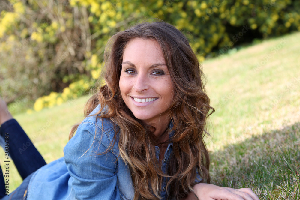 Portrait of beautiful woman relaxing in home garden Portrait of beautiful woman relaxing in home garden