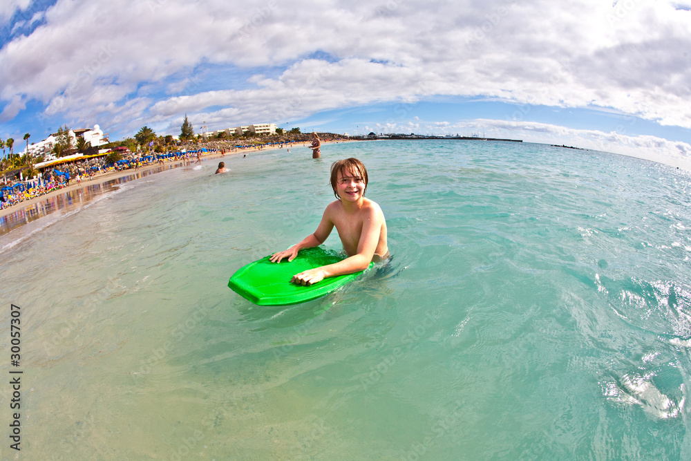 Fototapeta premium boy has fun at the beach