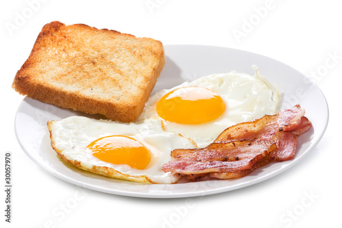 fried eggs with  bacon and toasts