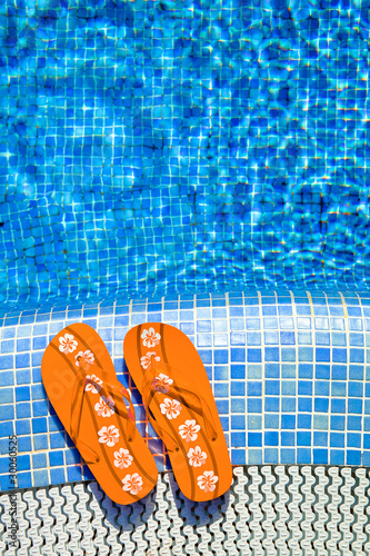 orange fliplops at the pool