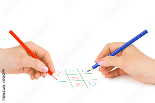 Hands with pencils and game