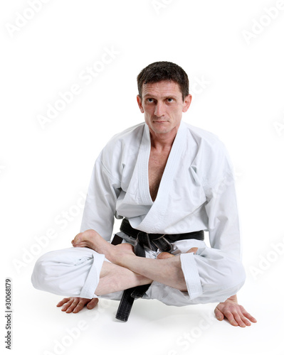 Karate, man in a kimono limberingup photo