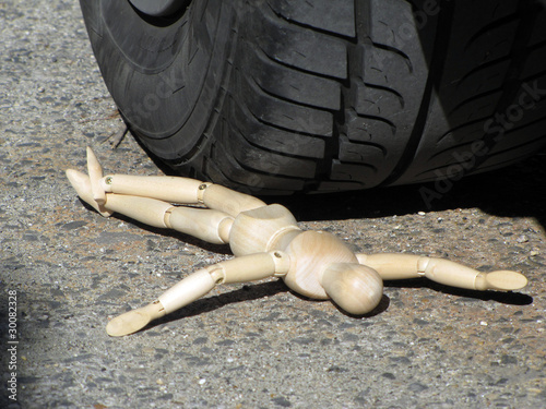 Accident, puppet under the wheel photo