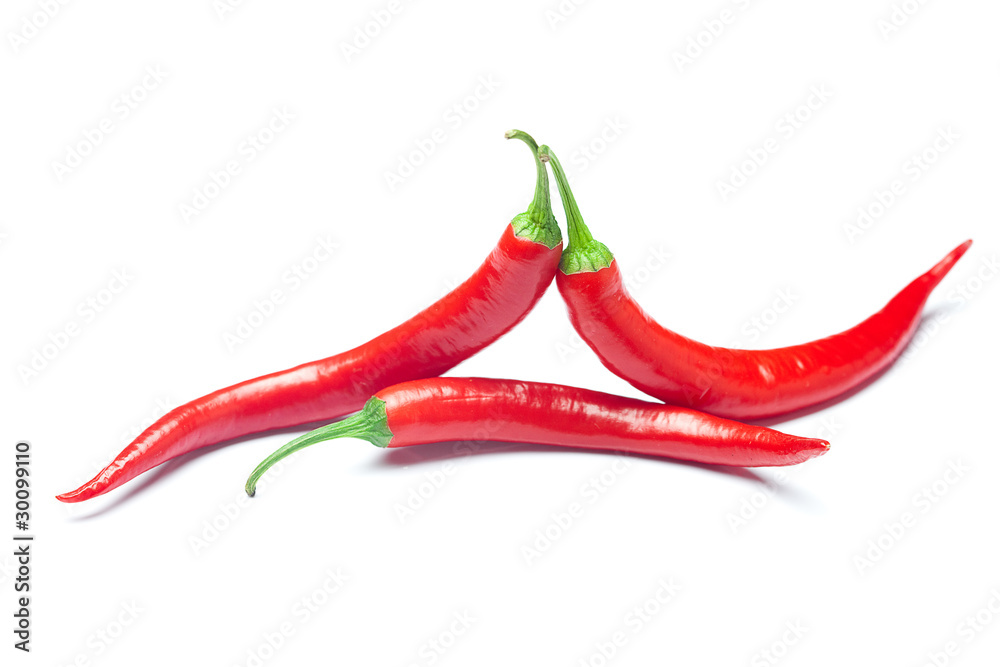 juicy red chili peppers isolated on white juicy red chili peppers isolated on white