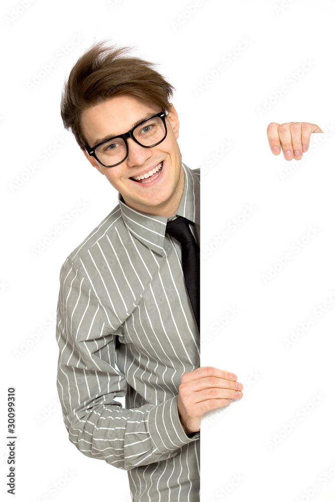 Young businessman with blank poster