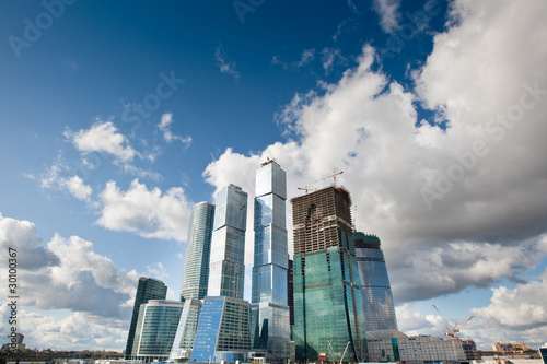 Many scyscrapers of Moscow city under blue sky photo