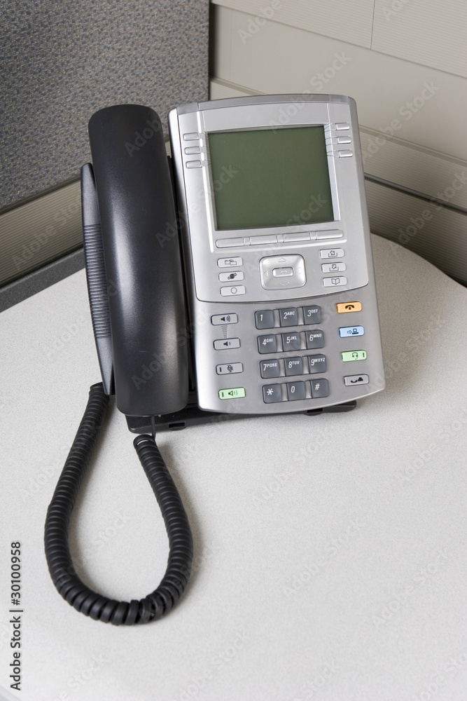 IP business telephone in an office cubicle IP business telephone in an office cubicle