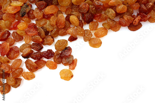 yellow raisins isolated on white