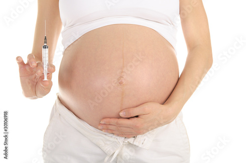 pregnant woman with syringe in hand