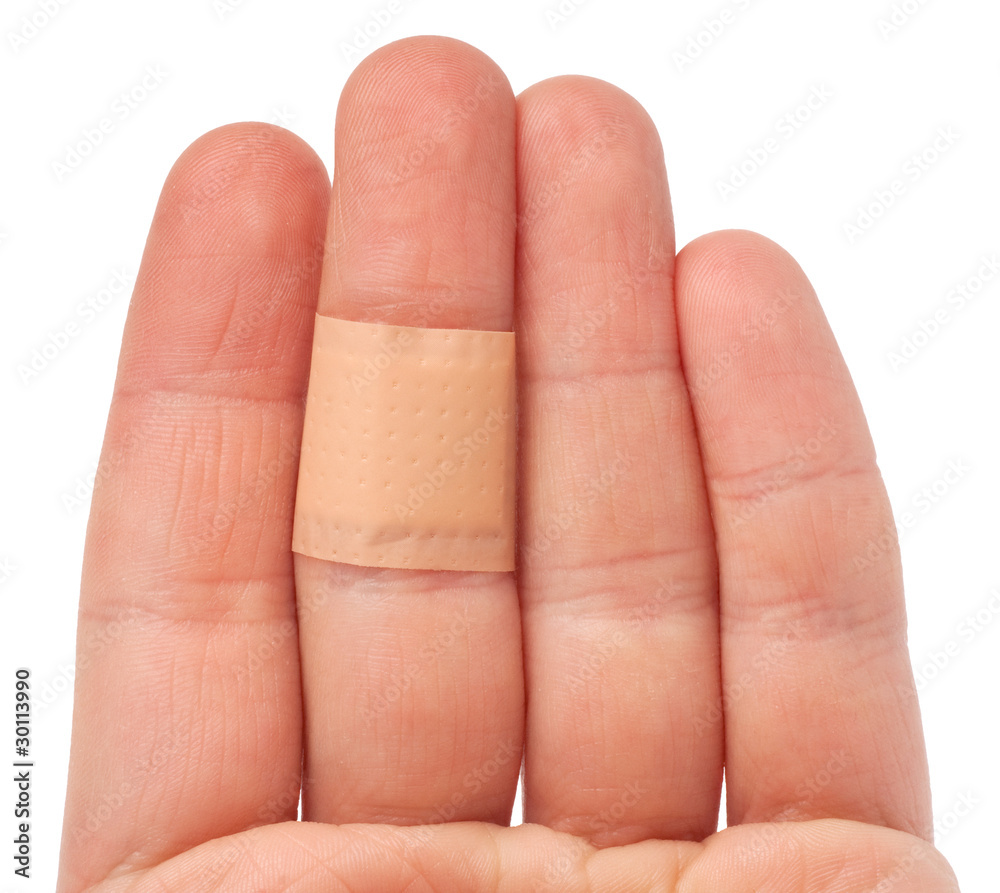 bandaid on hand isolated over white background bandaid on hand isolated over white background