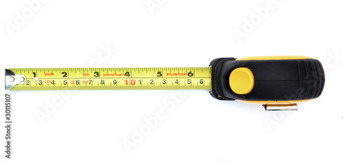 isolated yellow measuring tape on white from top