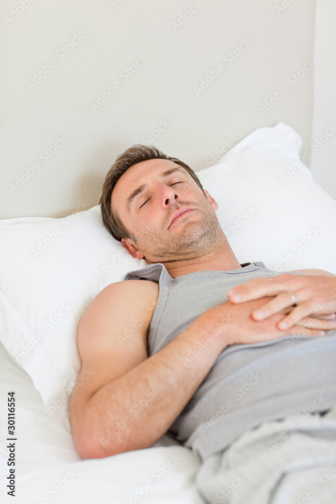 Man sleeping on his bed Man sleeping on his bed