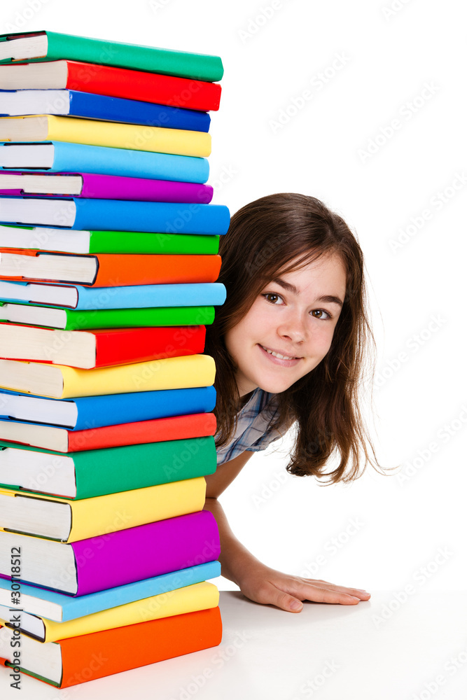 Girl behind pile of books isolated on white background Girl behind pile of books isolated on white background