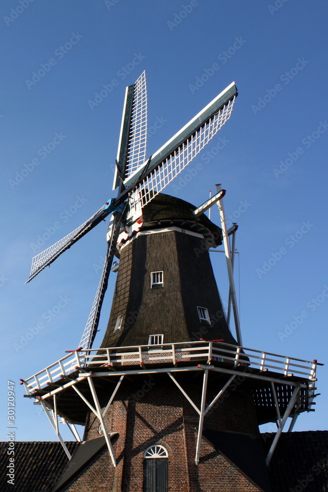 Old dutch windmill in Roderwolde in the Netherlands