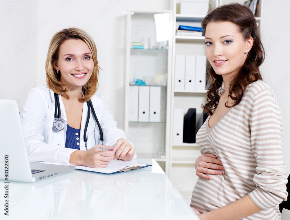 Happy pregnant woman and doctor Happy pregnant woman and doctor