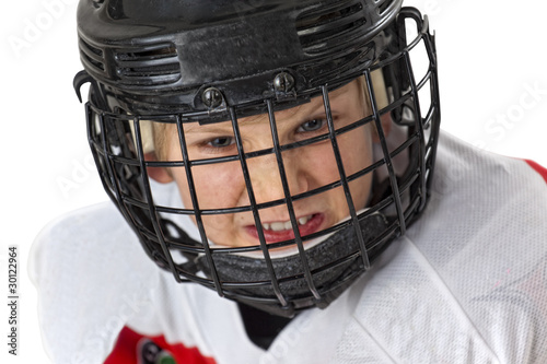 A young courageous hockey player with helmets photo