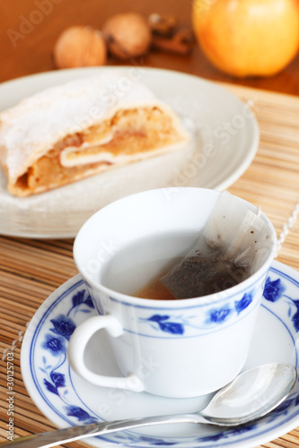 cup of tee in old porcelain with apple strudel