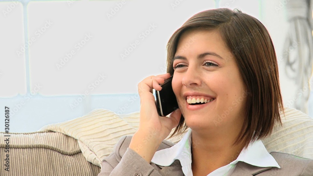 Cute brunette speaking on the phone Cute brunette speaking on the phone