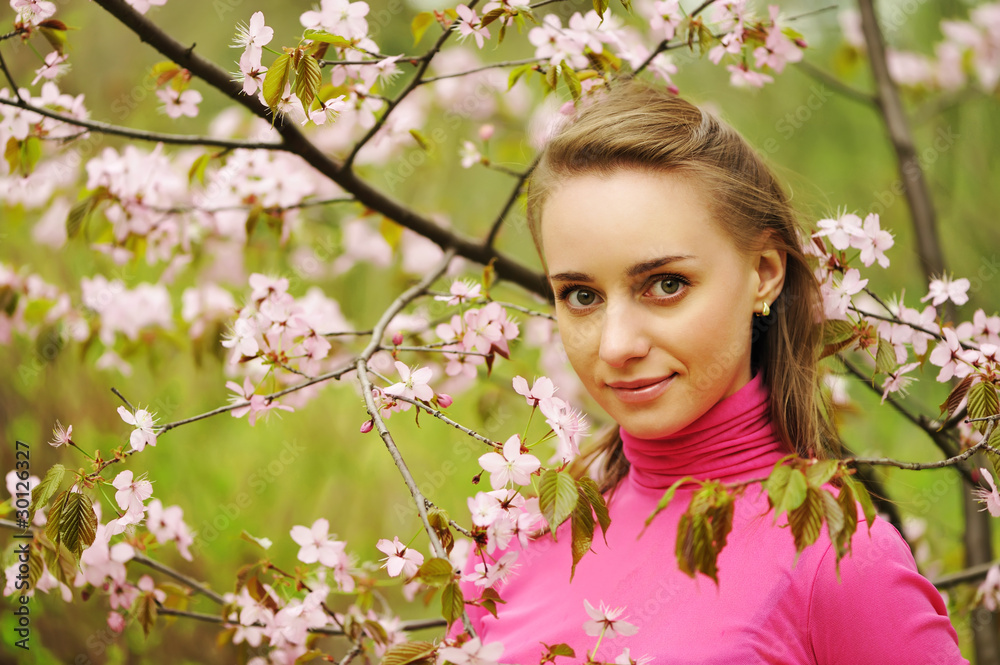 Woman in front of sakura blossoms Woman in front of sakura blossoms