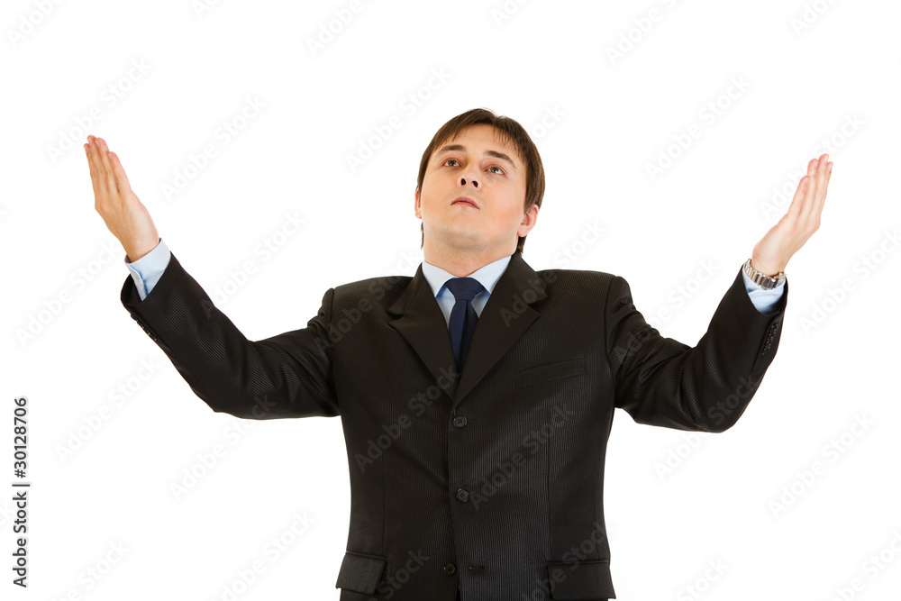 Sad businessman looking up and raising his hands Sad businessman looking up and raising his hands