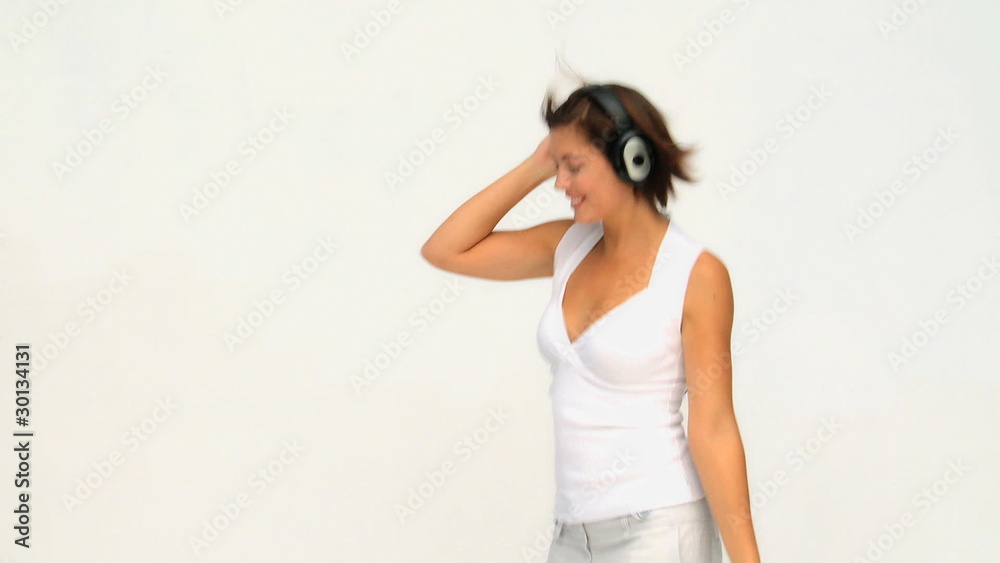 Brunette female dancing with headphones Brunette female dancing with headphones