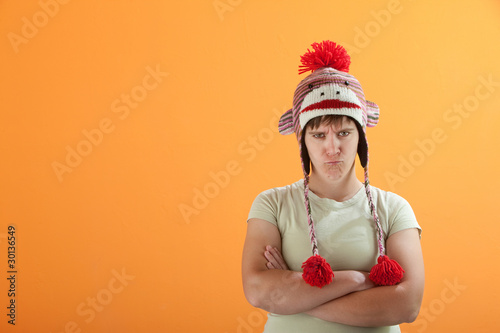 Upset young Caucasian woman in Monkey Cap photo