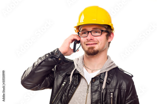Handsome Young Man in Hard Hat on Phone © Andy Dean