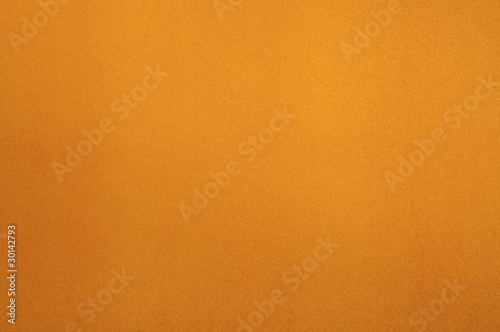 Texture of dense cardboard with yellow velvety coating