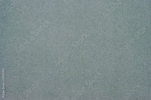 Texture of dense cardboard with grey velvety  coating