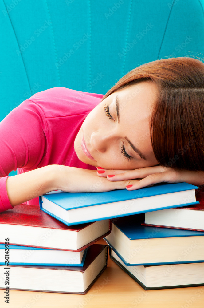 Young female student with many study books Young female student with many study books