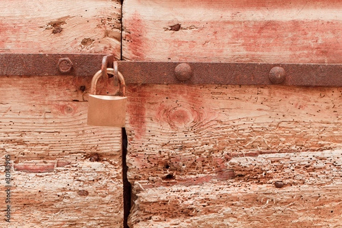 Padlock and old door