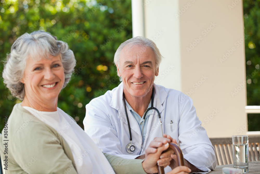 Senior doctor talking with his mature patient Senior doctor talking with his mature patient