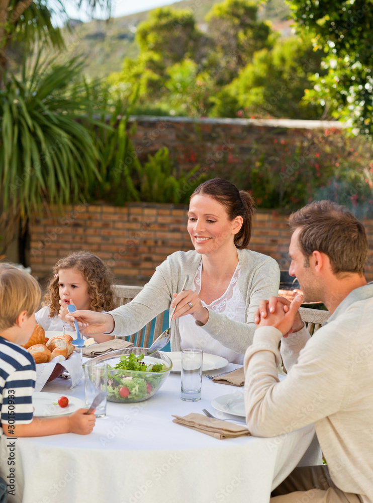 Family eating in the garden