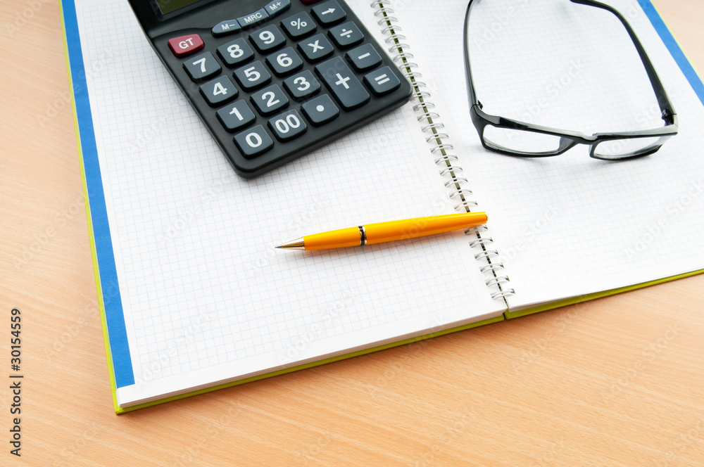 Business concept with notepad and calculator Business concept with notepad and calculator