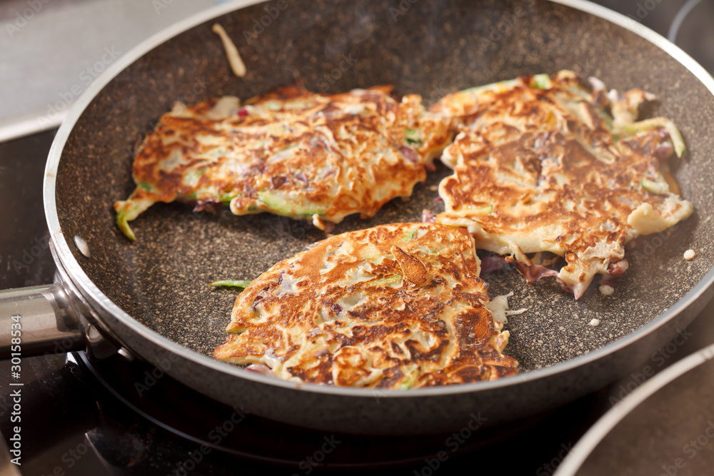 vegetables pancakes on the pan vegetables pancakes on the pan