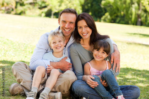 Family sitting in the park © WavebreakMediaMicro