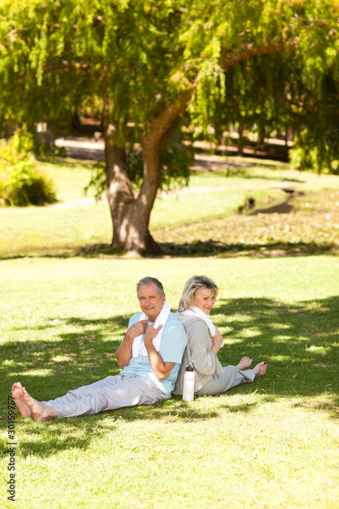 Couple after their streches in the park Couple after their streches in the park
