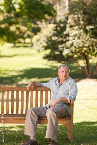 Elderly man sitting on a bench © WavebreakMediaMicro