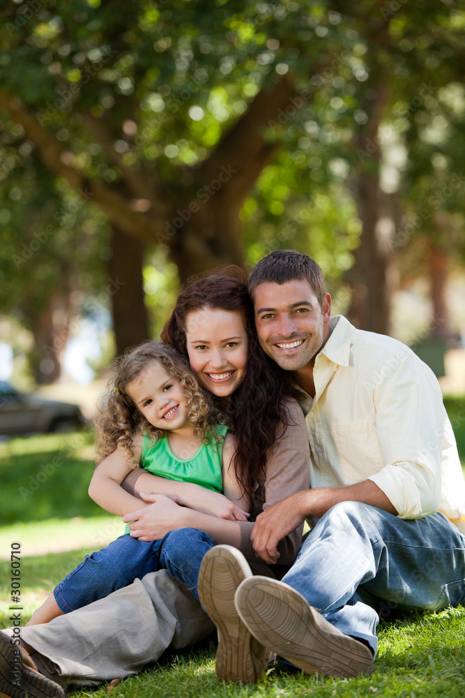 Radiant family sitting in the garden