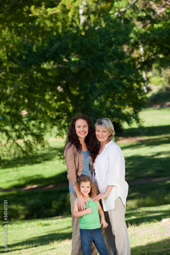 Family looking at the camera in the park Family looking at the camera in the park
