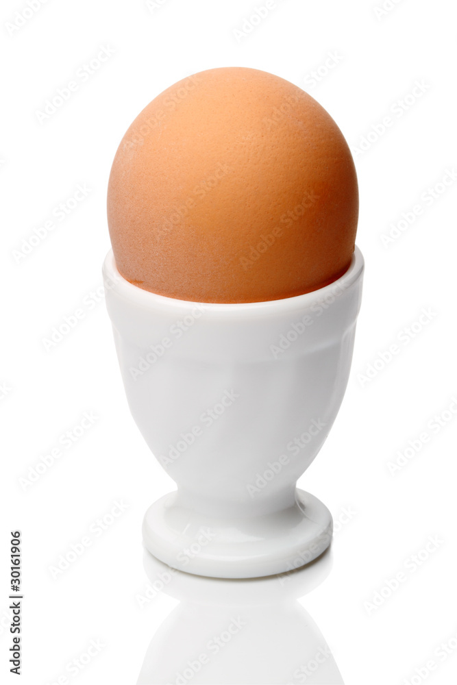 Single egg in cup isolated