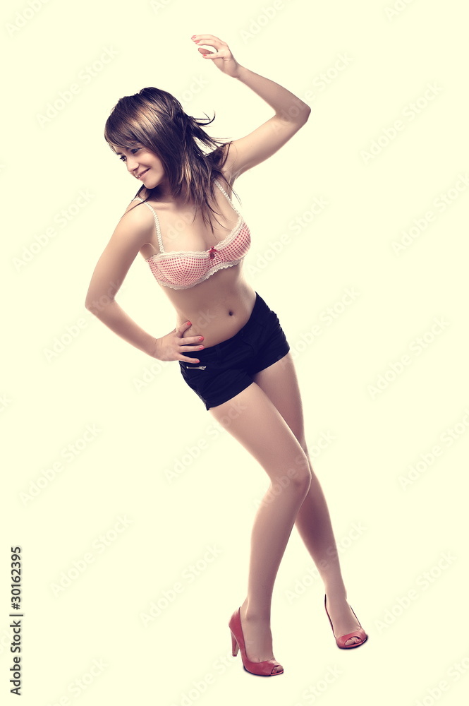Naklejka premium Young, beautiful woman posing in studio