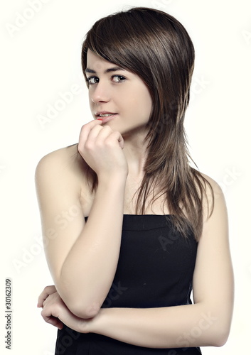 Young, beautiful woman posing in studio