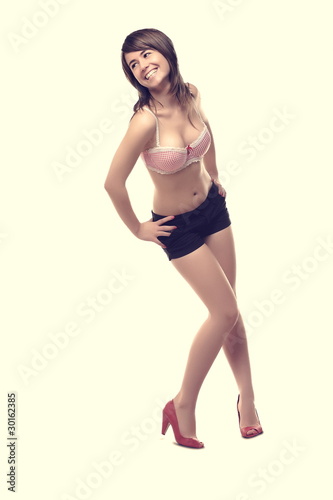 Young, beautiful woman posing in studio