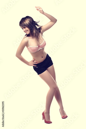 Young, beautiful woman posing in studio