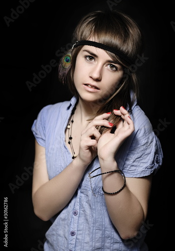 Young, beautiful woman posing in studio