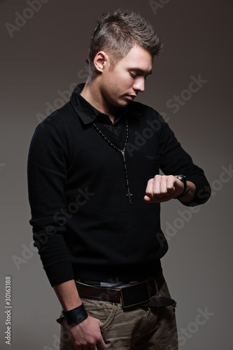 man looking at watch