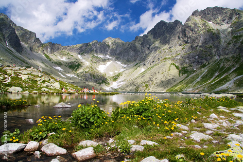 Mountain lake in background with high mountain photo