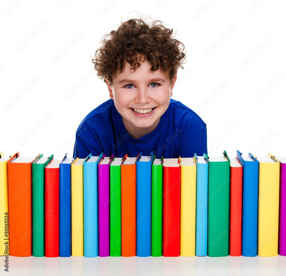 Boy behind pile of books isolated on white background Boy behind pile of books isolated on white background