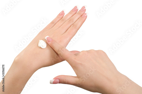Applying hand cream.